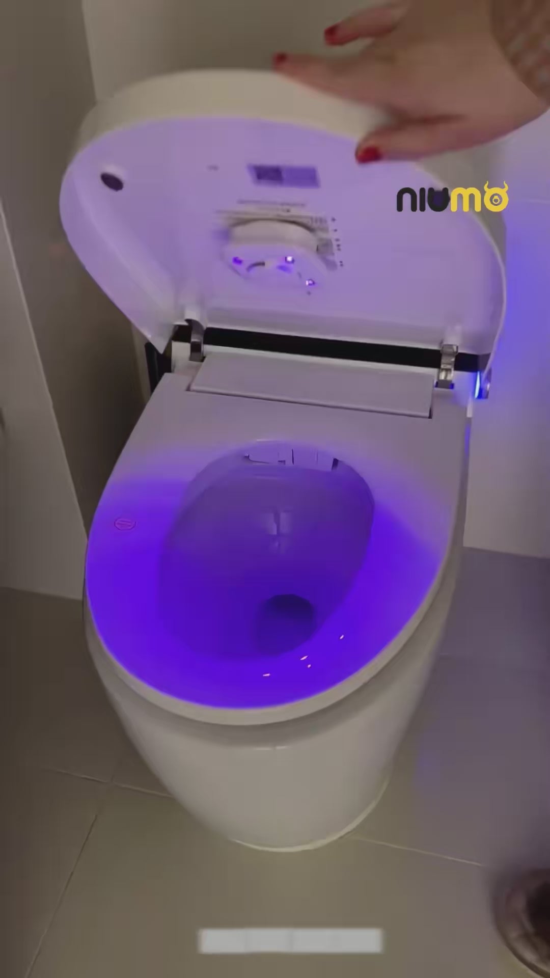 The LumaClean UV sanitizer glowing inside a toilet bowl as it runs a cycle.